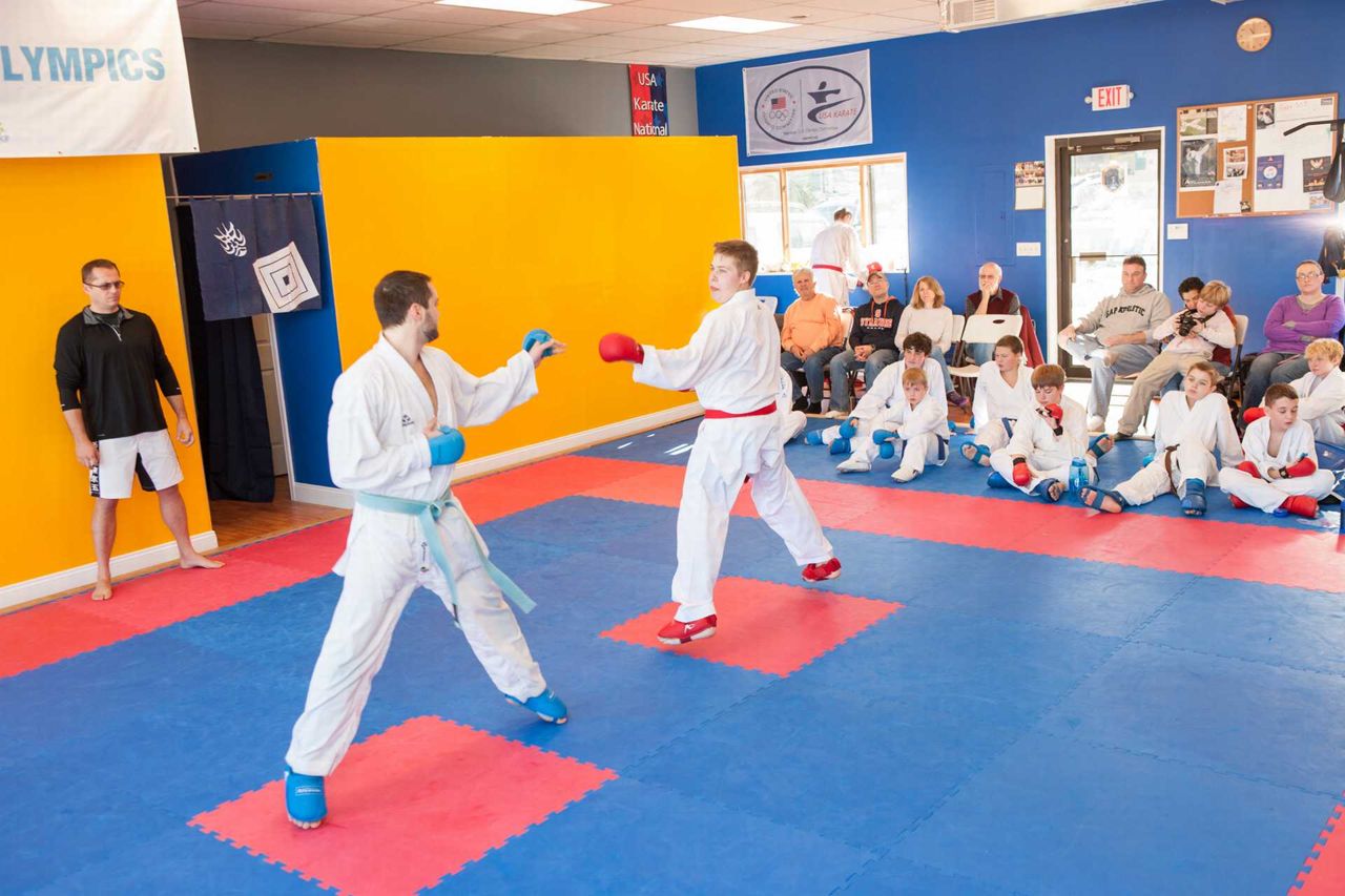 Young students sparring on the dojo mat