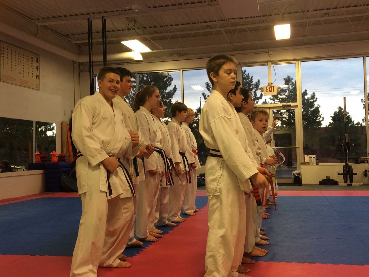 Adult students in training uniforms